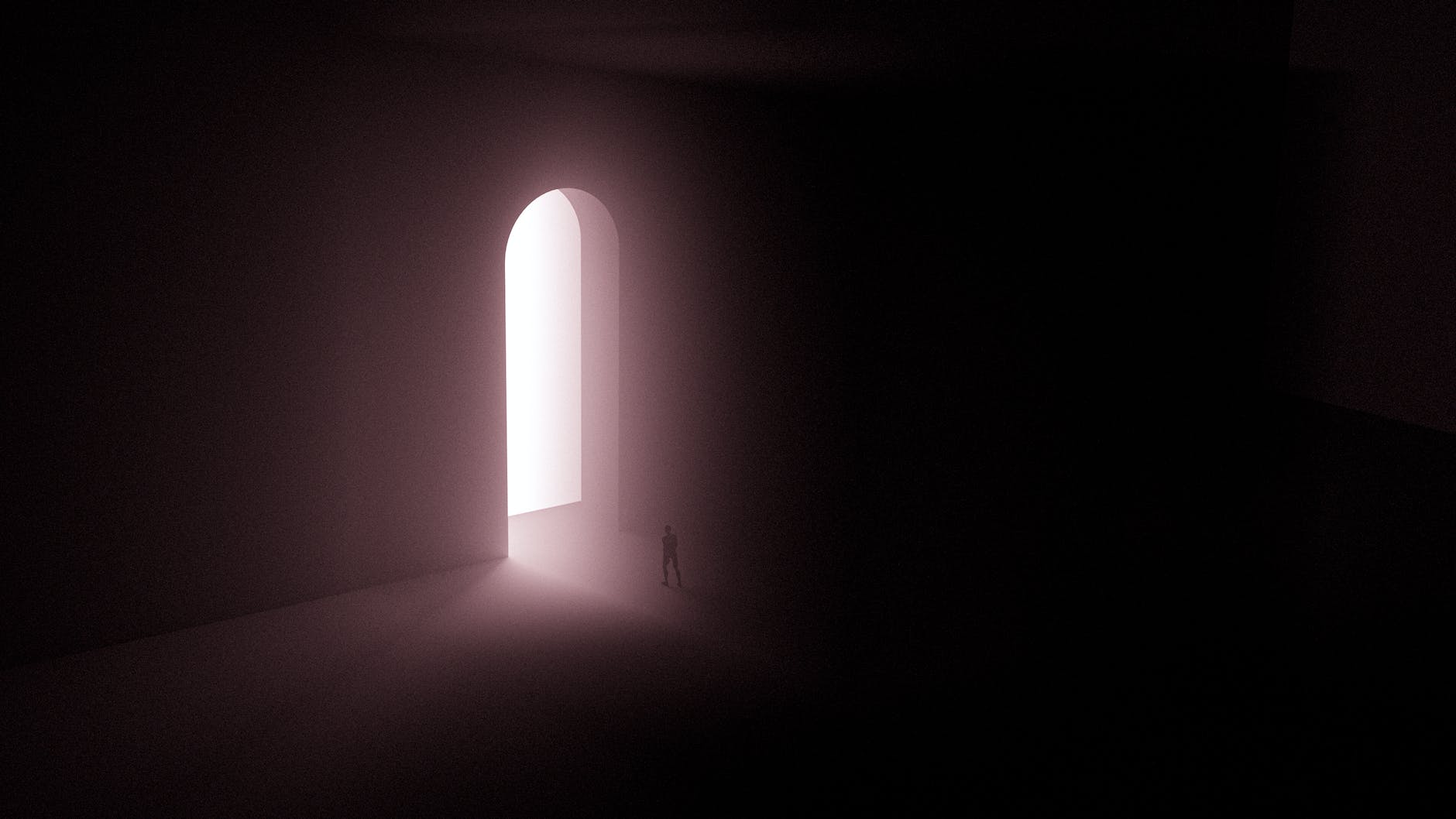 silhouette of person standing near a doorway with bright light